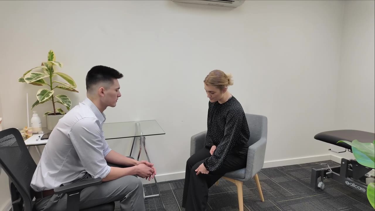 A physio and a patient at a first appointment